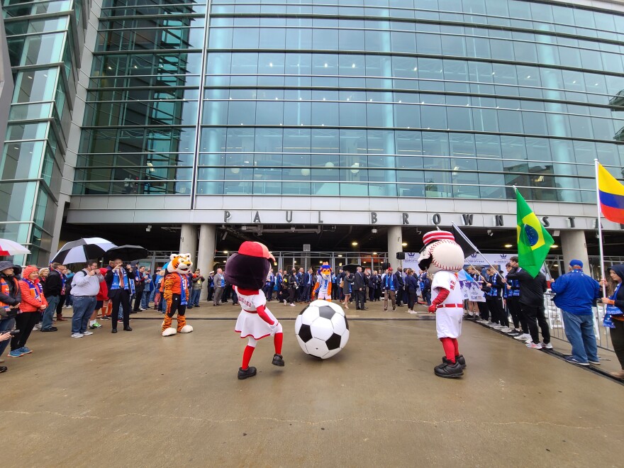 Cincinnati sports' team mascot play with an oversized soccer ball as FIFA officials vet the Queen City as a possible 2026 World Cup venue.