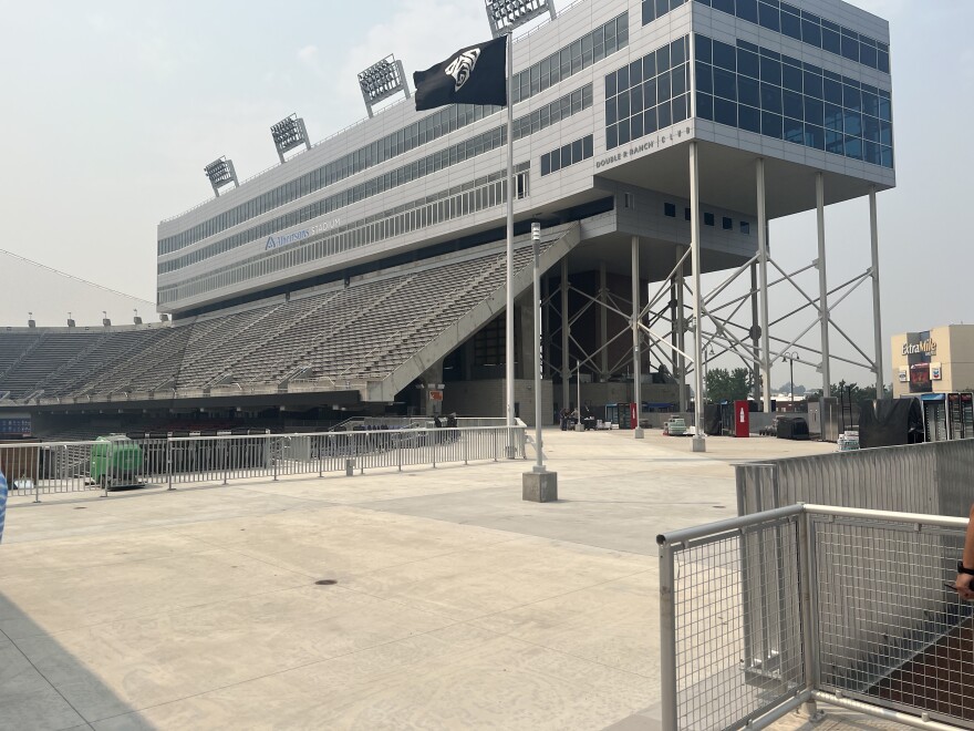 The open concourse on the NW corner of Albertsons Stadium, looking back on the Stuekle Sky Center. The new PAC-12 flag flies on a flagpole which will also be the home of the ‘Blue Chaos’ flag during games.