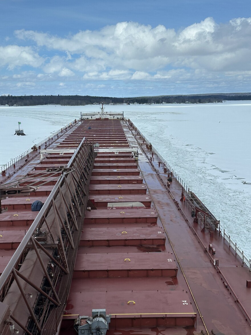 A ship on the Great Lakes surrounded by ice.