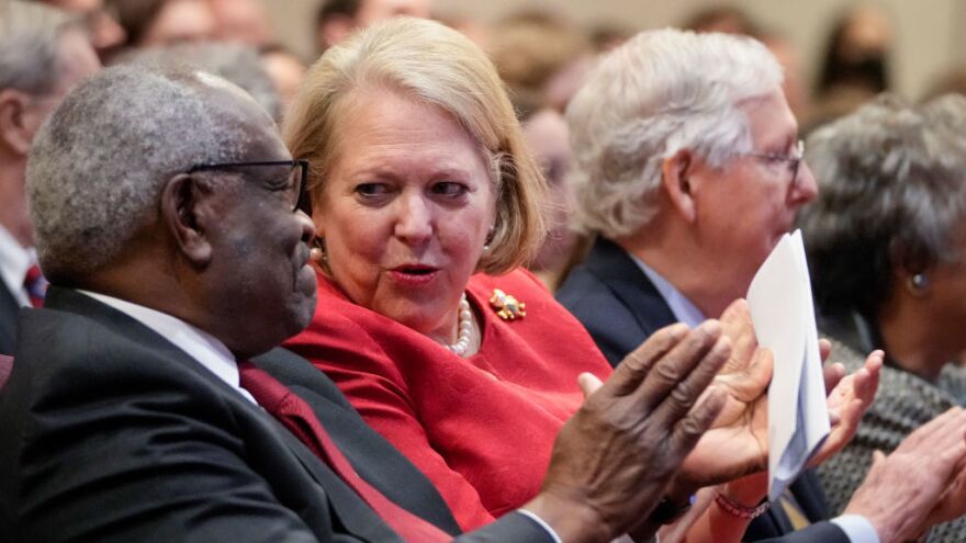 Supreme Court Justice Clarence Thomas sits with his wife, conservative activist Ginni Thomas, at a Heritage Foundation event in October 2021 in Washington, D.C. Ginni Thomas reportedly encouraged efforts to overturn the 2020 election.