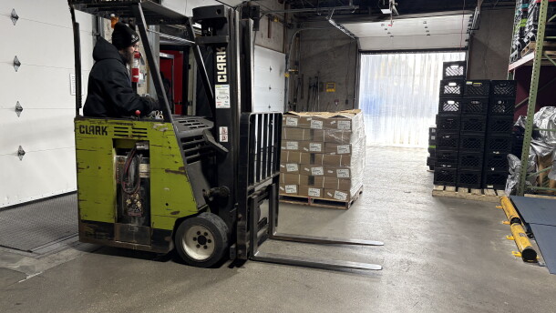40,000 pounds of spare ribs being unloaded at the Great Plains Food Bank.