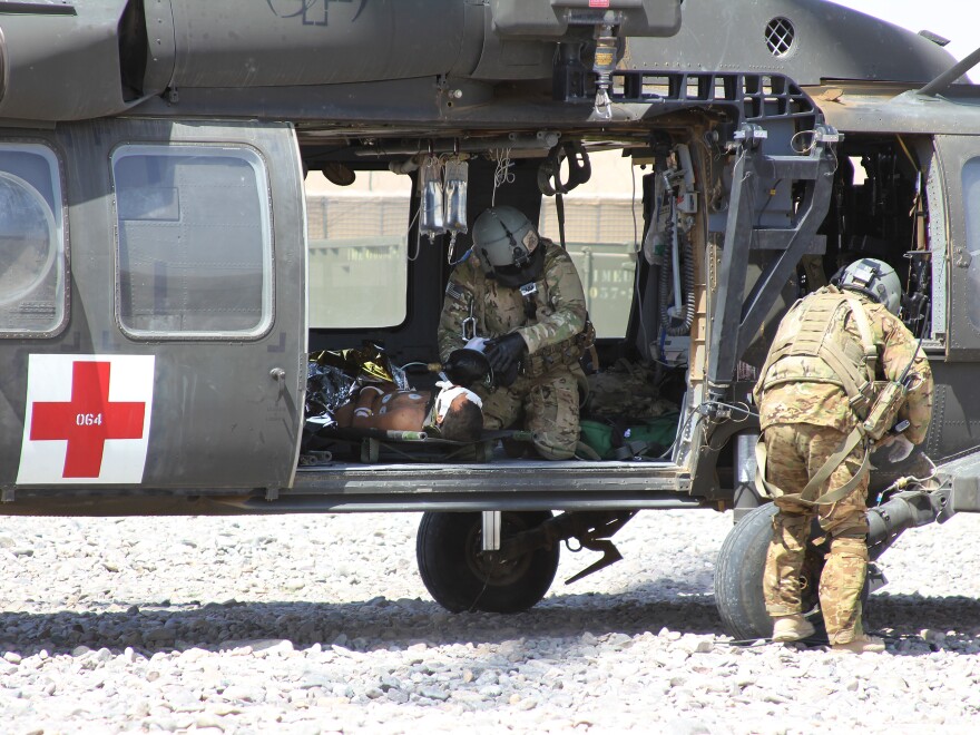 A NATO/U.S. medevac helicopter transports an Afghan civilian wounded by an IED near Camp Ricketts, a small NATO base in Muqur District, Badghis Province.
