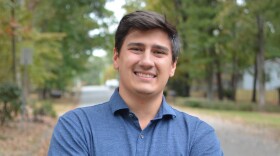 A man standing for a portrait.