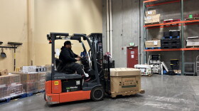 Inside the Food Bank of Northern Nevada’s warehouse, Elton Lintz drives a pallet jack to load up his semi-truck with pallets of fresh produce, canned goods, frozen meats, and bread.
