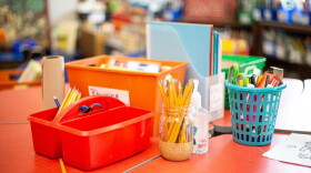 School supplies sit in a classroom.
