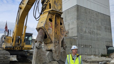 Northstar CEO Scott State stands alongside a massive concrete cracker below the nuclear reactor building on the former Vermont Yankee site.