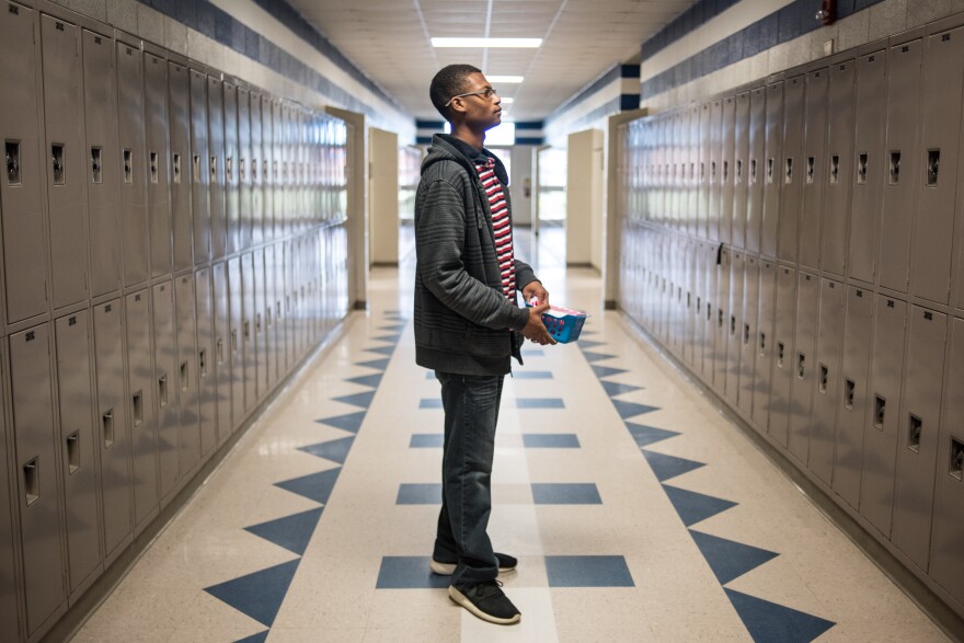 Robert Gordon pauses in the hallway of North Middle/High School while distributing letters to students regarding their ACT tests.