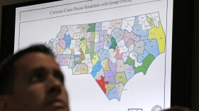 File photo of a districts map shown as a three-judge panel of the Wake County Superior Court presides over the trial of Common Cause, et al. v. Lewis, et al at the Campbell University School of Law in Raleigh, N.C., Monday, July 15, 2019.