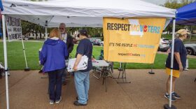 Volunteers with Respect Missouri Voters collect signatures during the No Kings demonstration at the Missouri State Capitol in Jefferson City, Missouri, Oct. 18, 2025. Respect Missouri Voters is the intiative petition campaign for a constitutional amendment that would make it harder for the General Assembly to overturn citizen-led ballot measures.