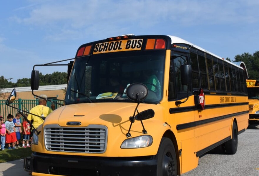 A bus from Elkhart Community Schools is shown. The district says one of its drivers is under investigation and is not currently transporting students.