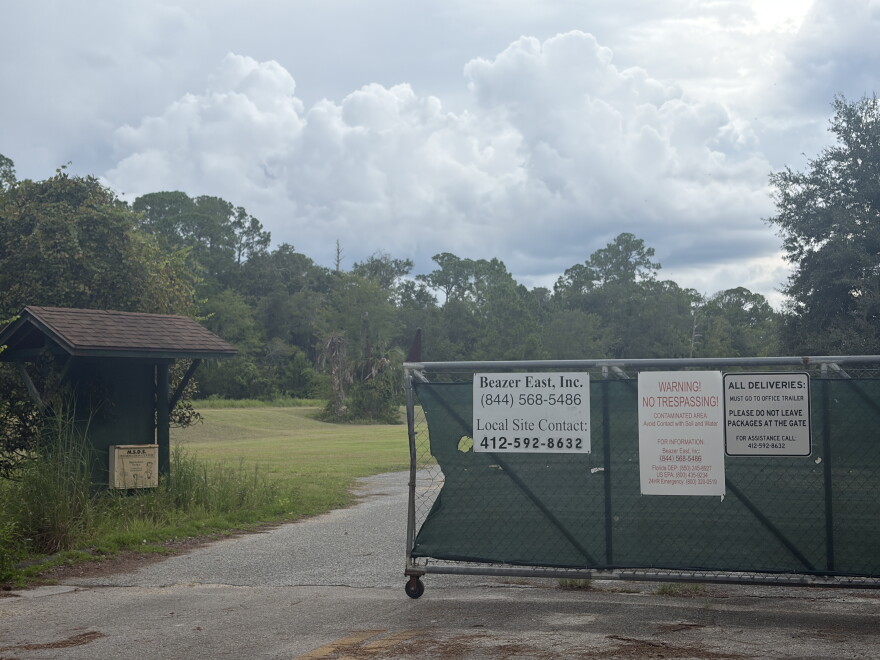 A gate blocks the entrance to the Koppers property in Gainesville, Florida, on Sept. 11, 2026. Signs at the entrance identify Beazer East Inc. and warn visitors that the property is a contaminated area.