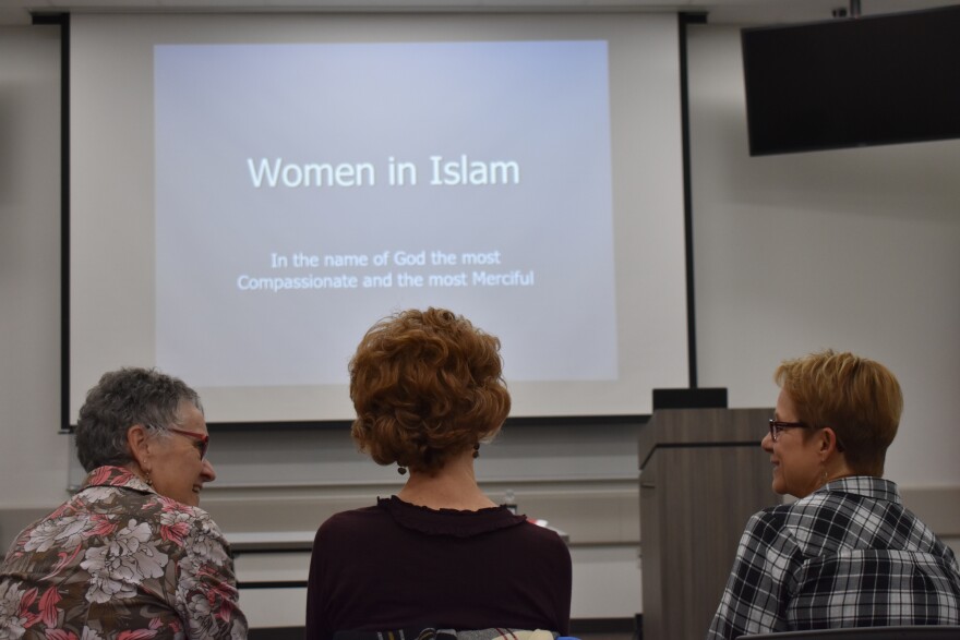 Barb Sheets (left), Laura Ruzicho (center) and Ruth Deyoe are Christians. They sat front row at the  HIjab Day event to learn more about the Muslim religion.