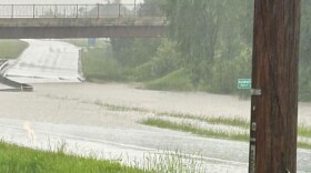 Water floods across Highway 169 in Hibbing under a bridge Tuesday, June 18, 2024, in this photo provided to the National Weather Service via social media by Carrie Gustavsson.