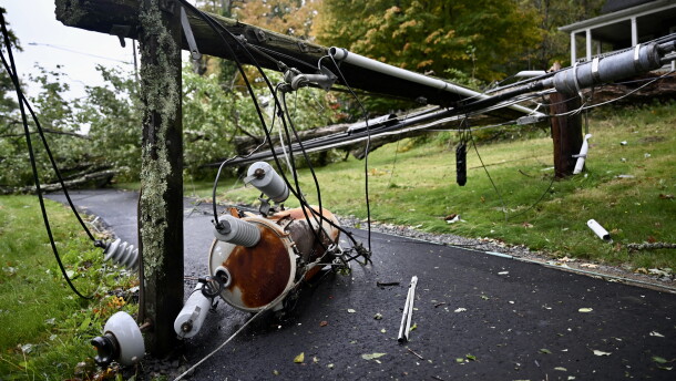 Power lines and tree branches cover a sidewalk in Mansfield, Connecticut. during a nor’easter on Sept. 27, 2026.