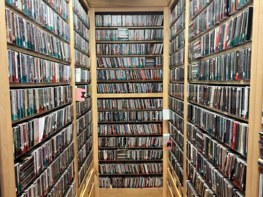 The music library at KAXE with rows of CDs