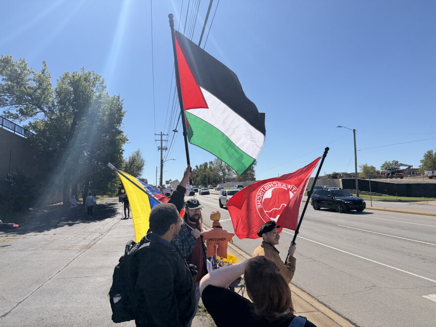 "No Kings" protester Earchiel Johnson waves a Palestinian flag on the sidewalk of Yale Avenue Saturday, Oct. 17, 2026.