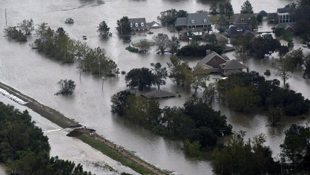This aerial photo shows an intentional levy breach created to alleviate trapped floodwater in the community of Braithwaite, La., in the aftermath of Isaac, Thursday, Aug. 30, 2012. Isaac soaked Louisiana for yet another day and pushed more water into neighborhoods all around the city, flooding homes and forcing last-minute evacuations and rescues. (AP Photo/Gerald Herbert)