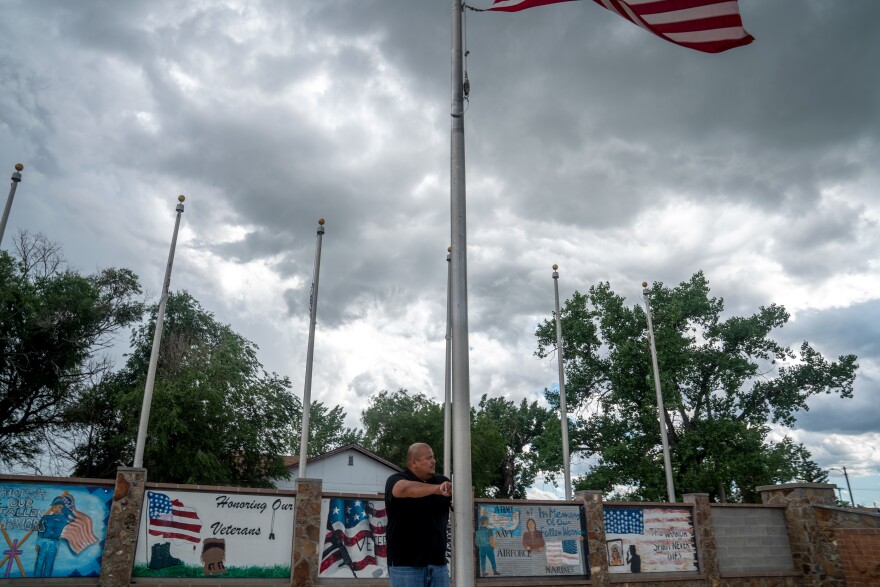 Native veteran Jestin Dupree raises and lowers the American flag every day near the Native Veteran Memorial in the heart of the Fort Peck Indian Reservation.