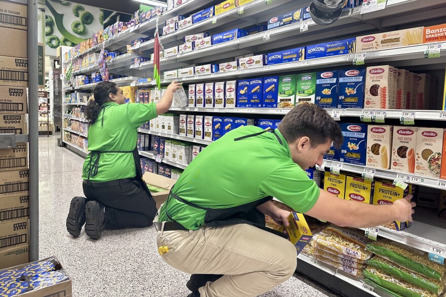 Publix employees stock one of the most popular items on Wednesday morning. (Nicholas Mascilli/WUFT)