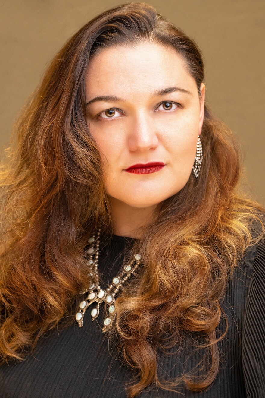 Kirsten C. Kunkle is a Muscogee Nation citizen from the Wind Clan. She is the soprano soloist performing Ko'koom'fena on August 30, 2026, at McFarlin Memorial United Methodist Church.