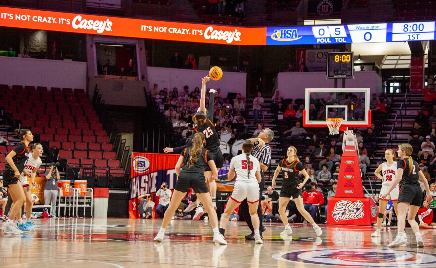 Girls high school basketball players inside an arena