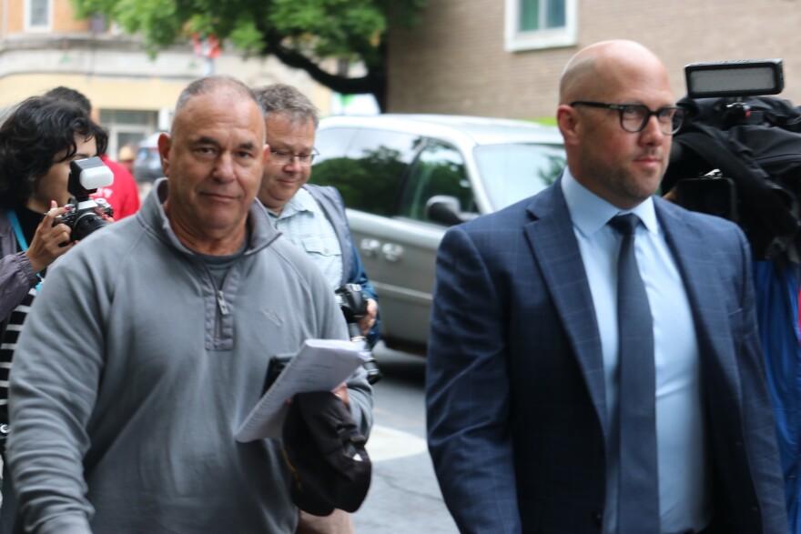Konstantinos “Kosta” Diamantis leaves federal court with his lawyer in Hartford on May 16.