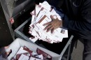 Seth Golding, right, and Braydon Galliers, left, a bipartisan team of ballot fulfillment coordinators, empty an absentee voter drop-off ballot box on Election Day outside of the Franklin County Board of Elections in Columbus, Ohio, Tuesday, Nov. 7, 2023. Polls are open in a few states for off-year elections that could give hints of voter sentiment ahead of next year's critical presidential contest. (AP Photo/Carolyn Kaster)