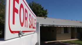 For Sale sign outside a house
