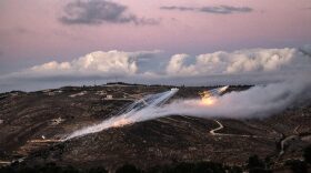 Artillery fire from an Israeli position hits the hills near the outskirts of the border town of Odaisseh in southern Lebanon.