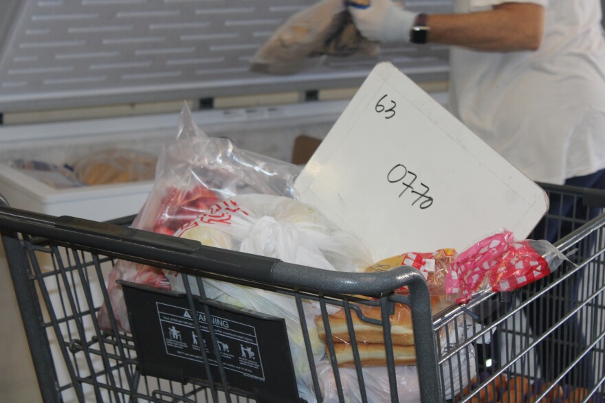 A cart full of food and a white board indicating a order number at The Pantry in Kalihi. ( Nov. 3, 2025)