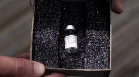 Health care workers received the first doses of a COVID-19 vaccine on Monday, Dec. 14.