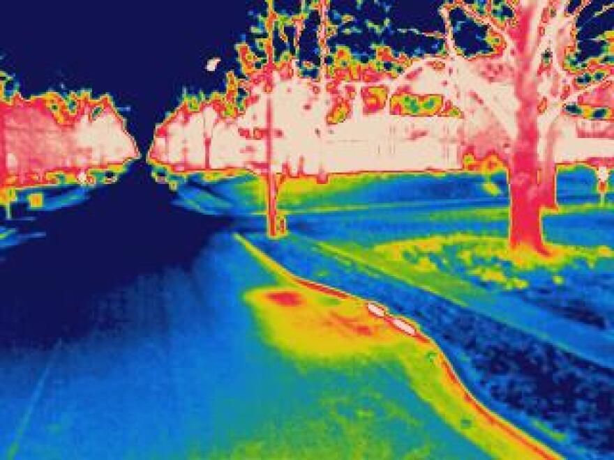 An infrared photograph shows a water main leak in Webster Groves. Water utility companies photograph roads at night to determine which pipes may be in need of repair. 