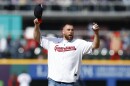 Kansas City Chiefs tight end Travis Kelce prepares to throw out the ceremonial first pitch before a baseball game between the Cleveland Guardians and the Seattle Mariners, Friday, April 7, 2023, in Cleveland.