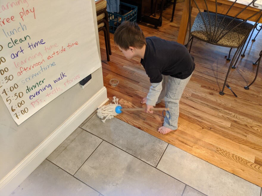 A routine can help children feel more secure during the COVID-19 crisis. Dusting is on the chore list for Amy Scott's son, Arlo.