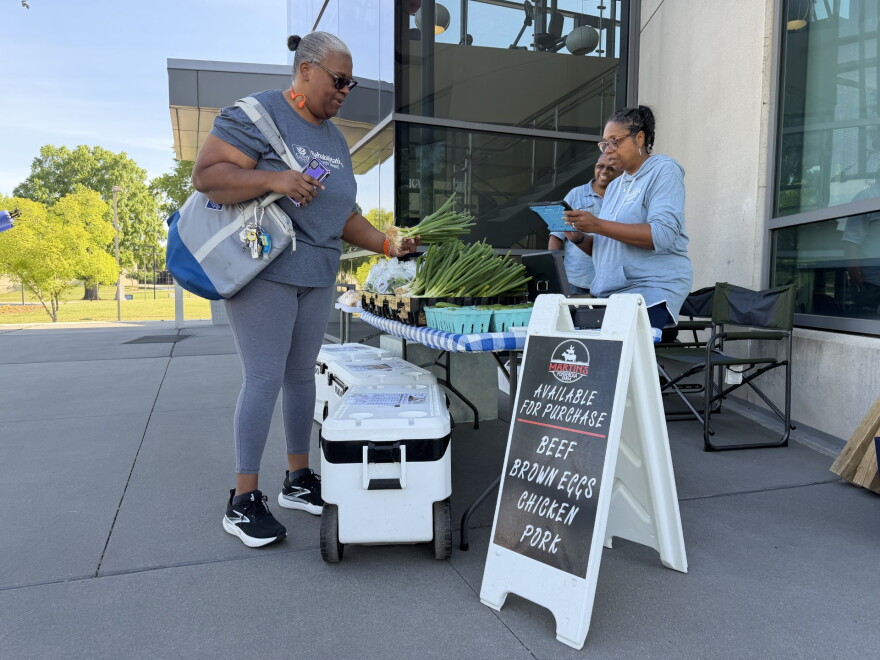 NC A&T State University's Extension holds a weekly farmers market in front of its student center. The market "quadruples the spending power" of people with SNAP benefits, allowing families to get fresh produce at a cheaper cost.