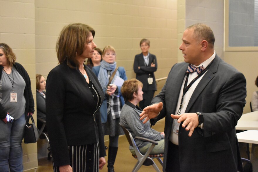 Rep. Cheri Bustos, left, on a tour of the OSF COVID-19 Pandemic Digital Response Center in Peoria on Wednesday, March 18, 2020. Dr. John Vozenilek, VP and Chief Medical Officer of Jump Trading Simulation and Education Center, explains how it works.