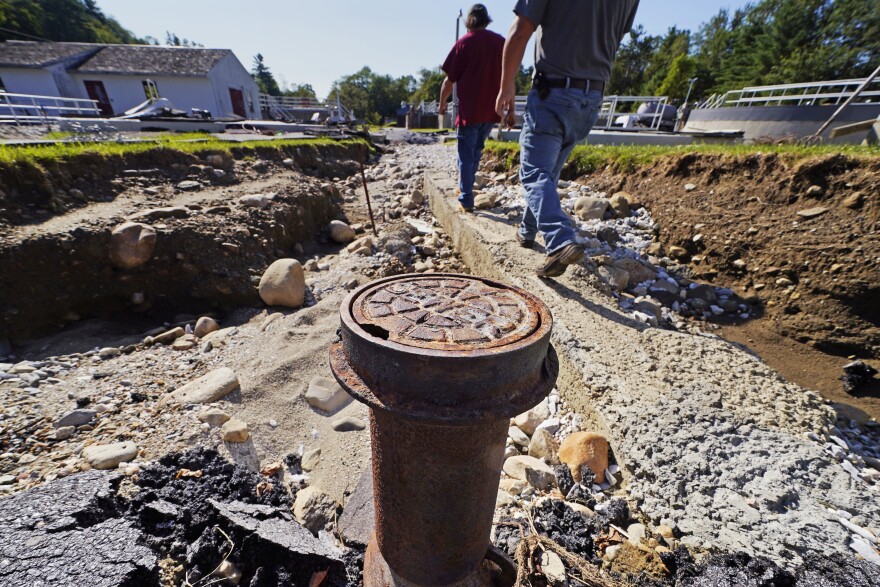 A sewer pipe is exposed due to eroded land at a wastewater treatment plant 