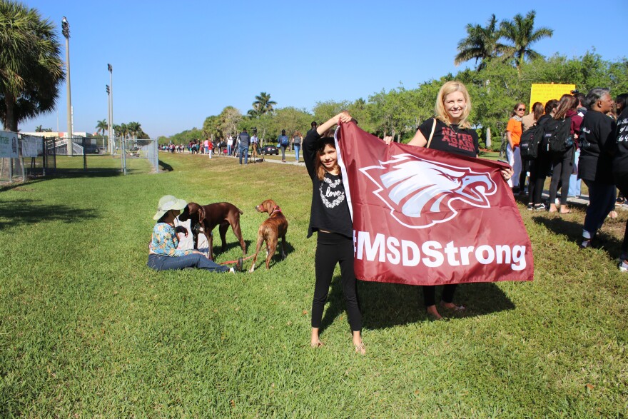 Addison Freed, left, and her mother and alumna of the high school, Melissa Freed, right, support the students protesting at Stoneman Douglas on March 14, 2018.