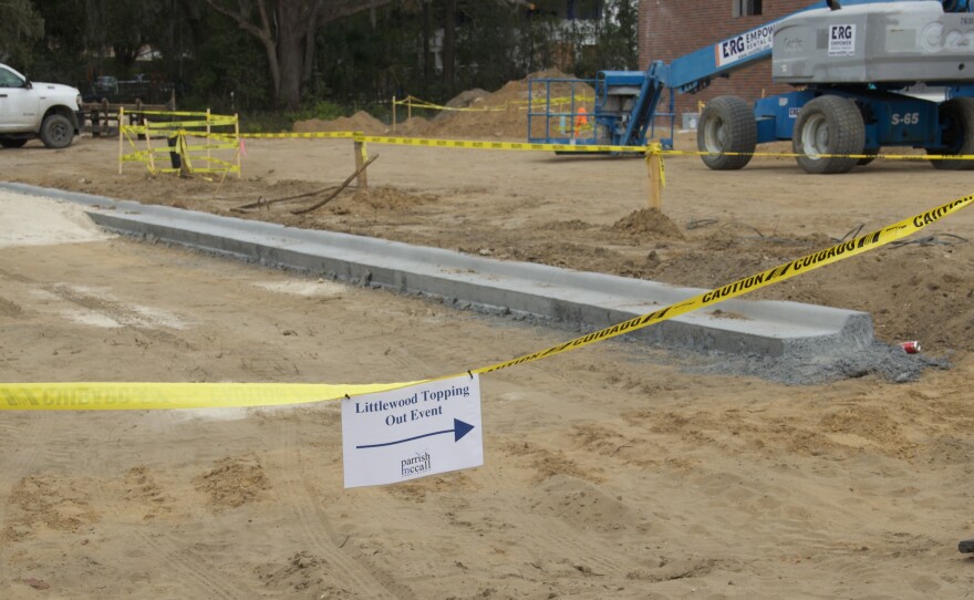 A sign directs guests to the site of the "Topping Out" event as construction progresses on Littlewood Elementary School's $37 million renovation project. (Chrystie Blot/WUFT News)