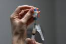 FILE - Lauren Ellenburg, a nurse, prepares a combination measles, mumps and rubella vaccine for a patient at Tiger Pediatrics in Easley, S.C., March 17, 2026.