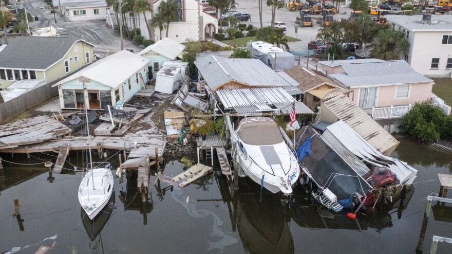 As it passed nearly 100 miles offshore, Hurricane Helene generated a powerful storm surge that swept boats ashore in Madiera Beach near Tampa Bay.