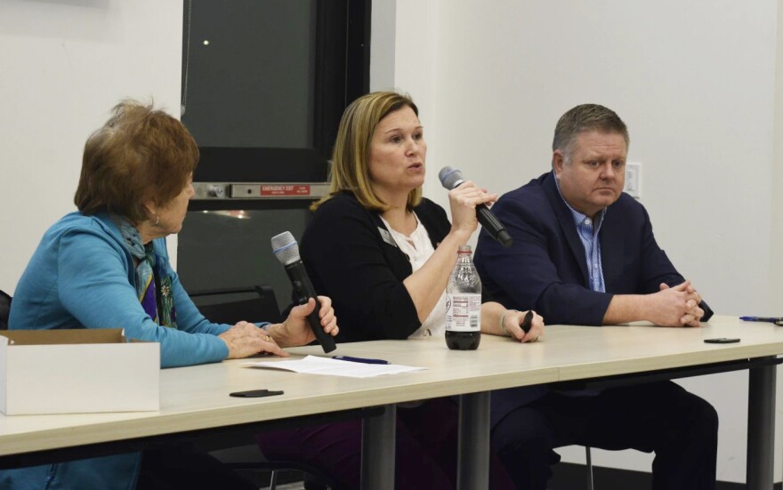 Unit 5 Superintendent Kristen Weikle answers a question from the audience at the League of Women Voters event, with District 87 superintendent David Mouser to her left.