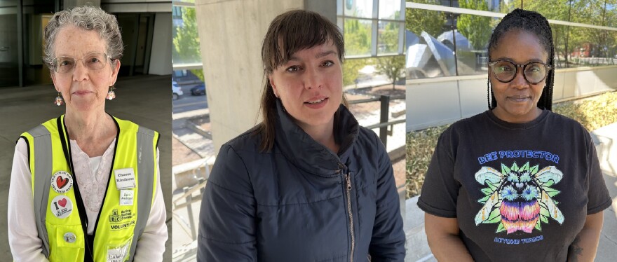 Three women standing outside courthouse.