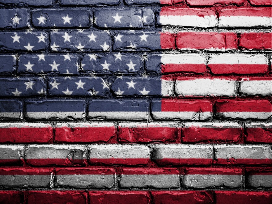 The U.S. flag painted on a brick wall