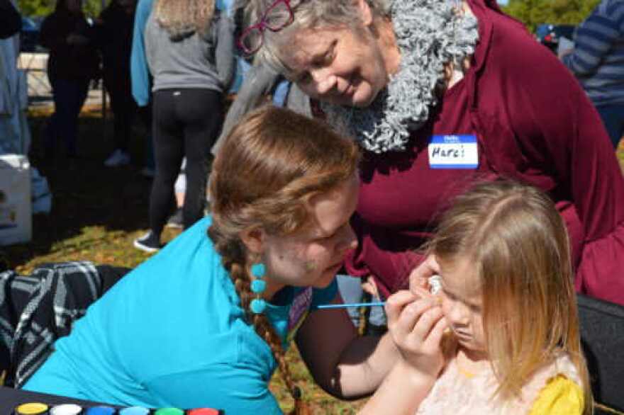 Florida Rep paints the faces of children and adults alike.