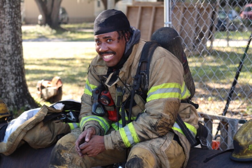 Lt. Alex Cowart listens to another firefighter describe their experience sawing through rebar. “Every piece of equipment that these guys have on has a tag on it saying firefighting is inherently dangerous,” Ennis said. (Jessica Seldner/WUFT News)