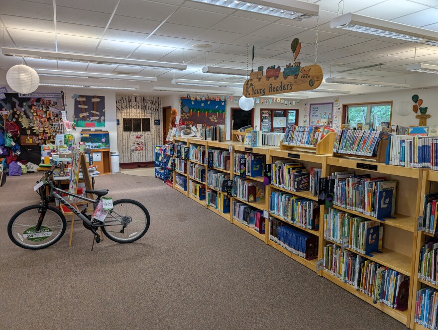 The Young Readers section of the library is jam-packed with books, puzzles and games. The bicycle is the grand prize for the Summer Reading Program winner. Kids can check out the backpacks on the rear wall to read the books and enjoy the activities inside the pack.