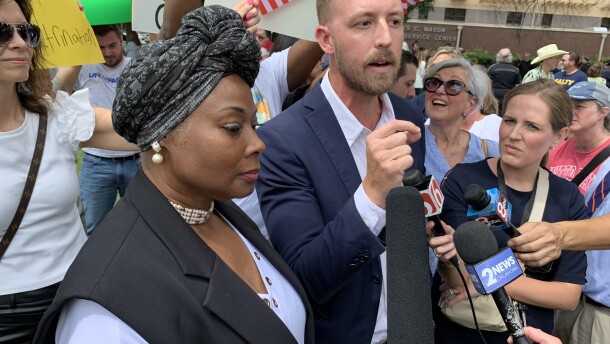Oklahoma State Superintendent Ryan Walters, right, speaks to reporters alongside Tulsa Public Schools board member E’Lena Ashley after a rally for religious freedom on Friday, July 21, 2023, on the front lawn of the TPS Service Center.