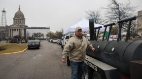 Dean Champion, an oil-field worker who does flowback work and well testing for Select Energy, mans a smoker at a March 2018 rally at the Oklahoma Capitol organized to push lawmakers to vote down proposed tax increases on oil and gas production.