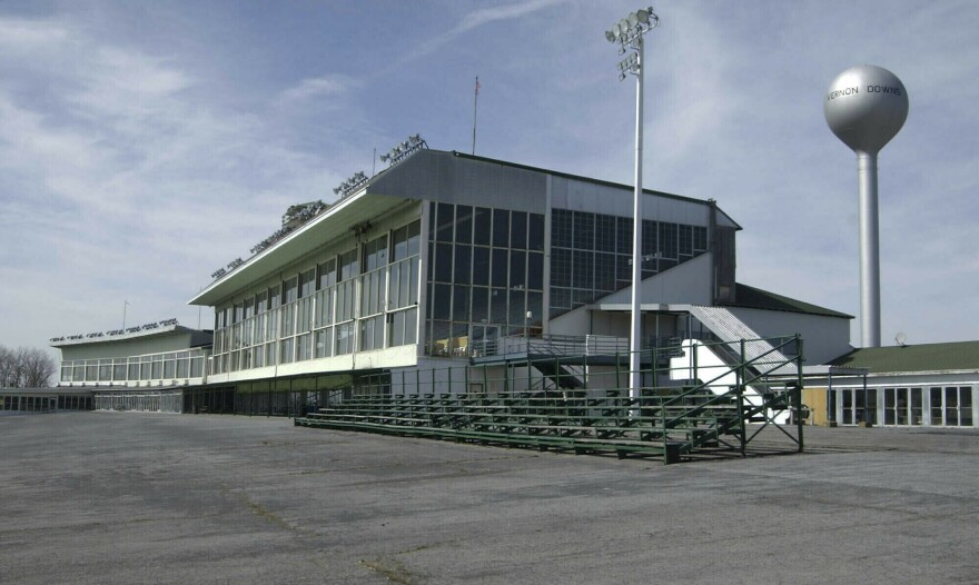 FILE - This March 30, 2004 file photo, shows the grand stands at Vernon Downs in Verona, N.Y. Oneida County Sheriff Rob Maciol is among the local officials and residents expressing concerns about upstate New York’s Vernon Downs harness track and casino hosting the 50th anniversary Woodstock festival Aug. 16-18. Vernon Downs could host up to 65,000 people, as opposed to the 150,000 planned for Watkins Glen, and it would not feature camping. (AP Photo/Kevin Rivoli, File)